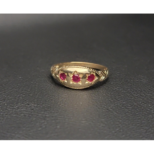 66 - PRETTY RUBY CLUSTER RING
the three round cut rubies set in a polished marquise setting with decorati... 