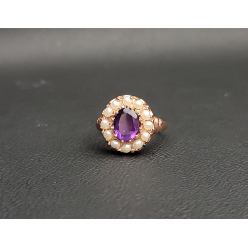 98 - AMYTHYST AND PEARL CLUSTER RING
the central oval cut amethyst approximately 1ct in a twelve pearl su... 