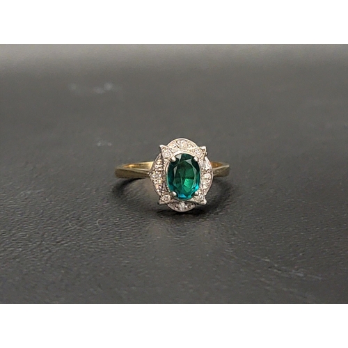 101 - EMERALD DOUBLET AND DIAMOND CLUSTER RING 
the central oval cut emerald doublet measuring approximate... 