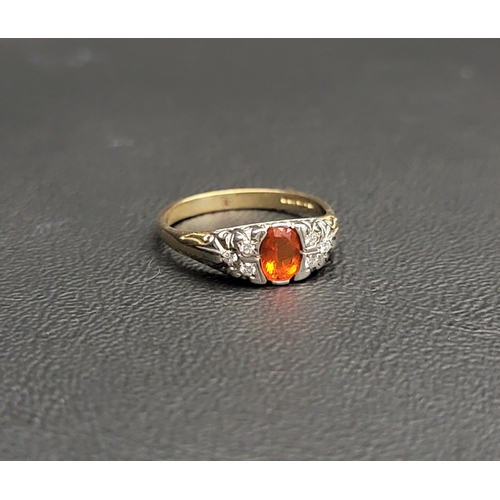 110 - PRETTY MEXICAN FIRE OPAL AND DIAMOND CLUSTER RING
the central oval cut Mexican fire opal measuring a... 