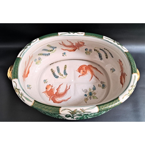 158 - CHINESE FAMILLE VERT FOOT BATH
with parcel gilt handles, the interior decorated with koi carp, the b... 