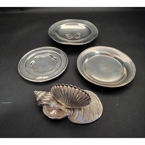 128 - THREE SILVER TRINKET DISHES AND A MENU HOLDER
one trinket dish with London hallmarks for 1916, anoth... 