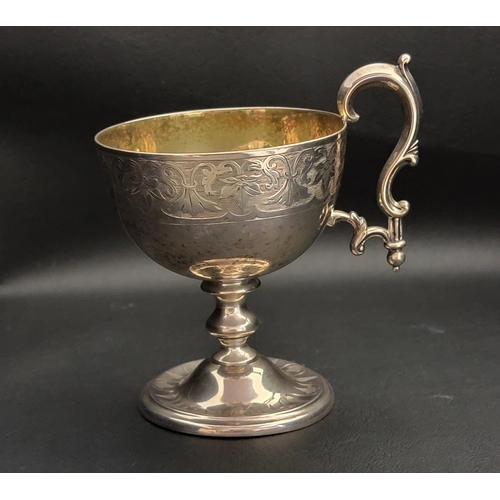 130 - VICTORIAN SILVER PEDESTAL WINE CUP
the circular foot below knopped stem and cup with foliate engrave... 