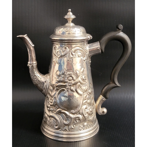 134 - RARE GEORGE II SILVER COFFEE POT BY EDWARD FELINE
the conical pot with profuse embossed floral and s... 