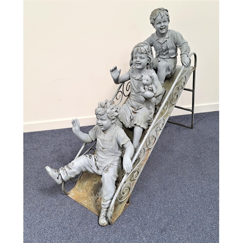 205 - STEEL GARDEN ORNAMENT
depicting three young children on a garden slide, painted grey, 110cm high