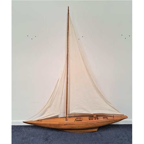 206 - SCALE MODEL OF A SCHOONER
the single mast with three sails and rigging, of teak and walnut construct... 