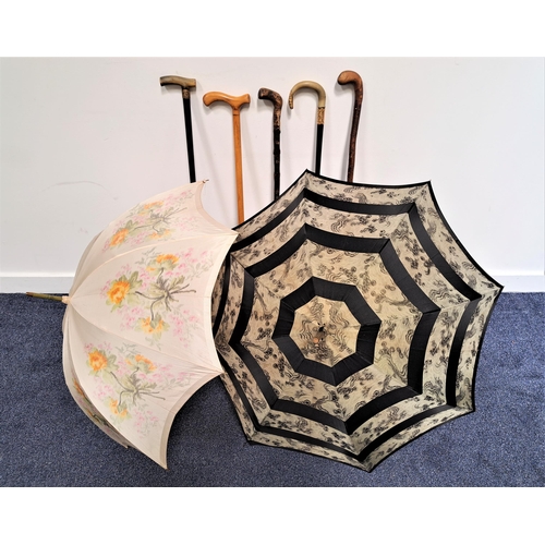 269 - TWO LADIES PARASOLS
with painted canopy's, together with five walking canes, two with horn handles (... 