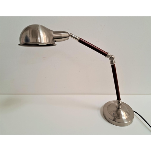 219 - MODERN ANGLE POISE LAMP
raised on a circular weighted base with a two section arm with a domed shade