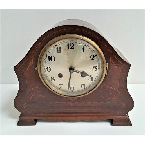 220 - EDWARDIAN MAHOGANY AND INLAID MANTLE CLOCK
with a shaped case and a circular silvered dial with Arab... 