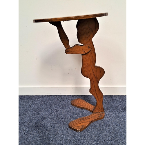 222 - VICTORIAN OAK FIGURAL DUMB WAITER
in the form of a boy holding an oval tray aloft, 76cm high