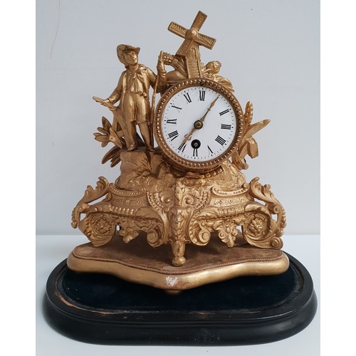 227 - FRENCH GILT METAL MANTLE CLOCK
the circular enamel dial with Roman numerals and a 30 hour movement, ... 