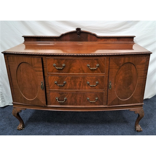 462 - MAHOGANY BOW FRONT SIDEBOARD
with a carved and shaped raised back above three central drawers flanke... 