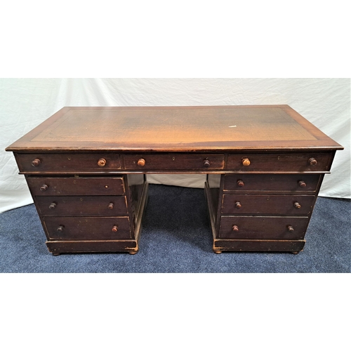 385 - MAHOGANY KNEEHOLE DESK
with an inset top above an arrangement of nine drawers, standing on flattened... 