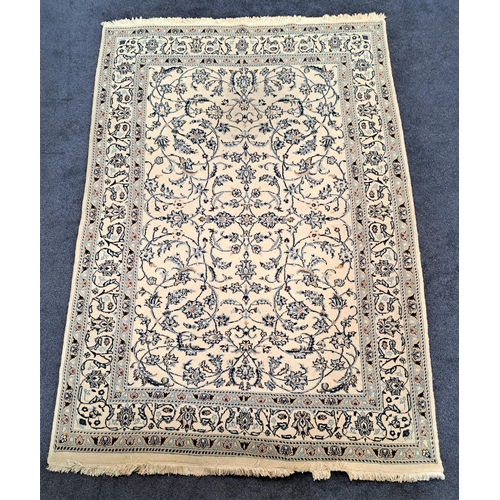 396 - NAIN RUG
with a cream ground and blue floral entwined pattern, 286cm x 197cm