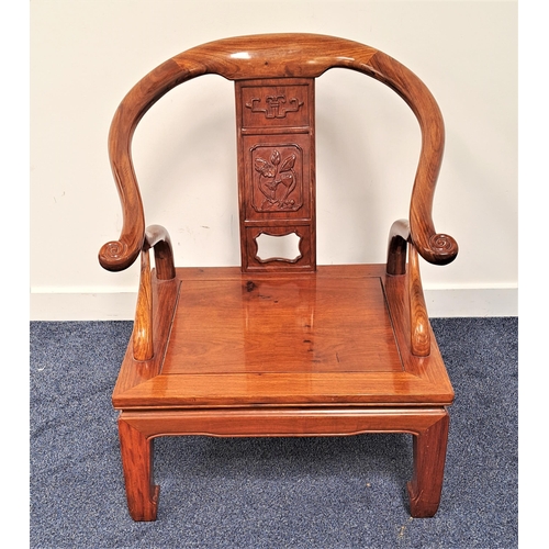 429 - CHINESE HORSESHOE ARMCHAIR
with a central carved splat above a panelled seat standing on shaped supp... 