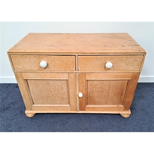 434 - STRIPPED AND WAXED PINE CHEST
with a rectangular top above two drawers with a pair of panelled cupbo... 