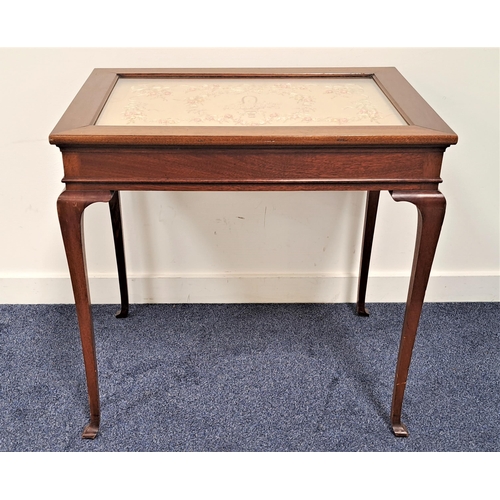 449 - LATE 19th CENTURY MAHOGANY SIDE TABLE
with a silk embroided panel under an inset glass top, standing... 