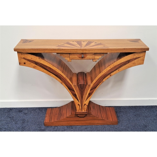 453 - ART DECO STYLE CONSOLE TABLE
with a rectangular top inlaid with a fan of specimen walnut above a cen... 