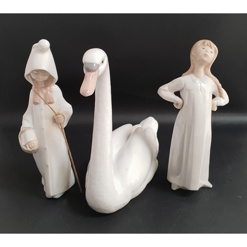 161 - THREE LLADRO FIGURINES
comprising Graceful swan 5230, 21.5cm high, Shepherd girl 4678, 21.5cm high a... 