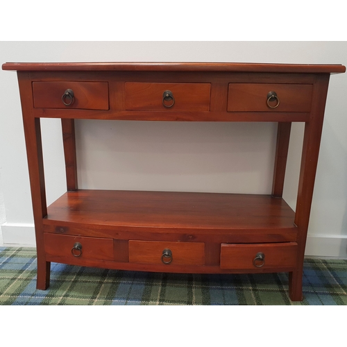 399 - BOW FRONT TEAK SIDE TABLE
with a moulded top above three frieze drawers, with a lower shelf and thre... 