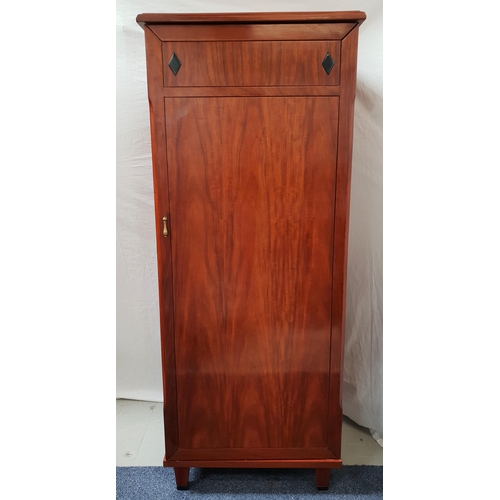 401 - LARGE TEAK DRINKS CABINET
with a panelled top and door opening to reveal drawers, ice bucket recess,... 