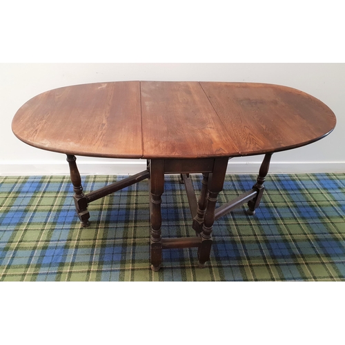 381 - OAK GATELEG TABLE
with shaped drop flaps, standing on turned supports, 90cm wide