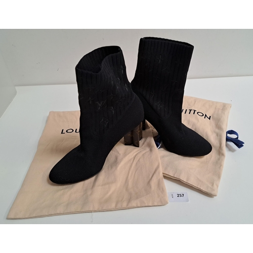 257 - PAIR OF LOUIS VUITTON SILHOUETTE ANKLE BOOTS
in black stretch fabric with patent Monogram canvas flo... 