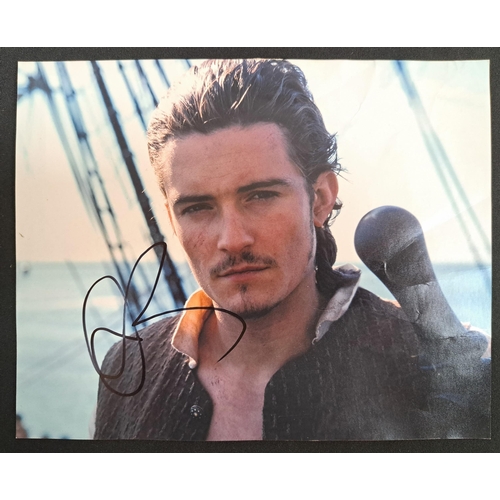 101 - ORLANDO BLOOM
signed 10x8 colour photograph as Will Turner from Pirates of the Caribbean
Note: Ameri... 