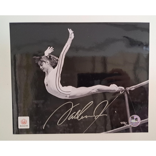 130 - NADIA COMANECI
signed 8x10 black and white photograph from Montreal 1976 Olympic Games, with Officia... 