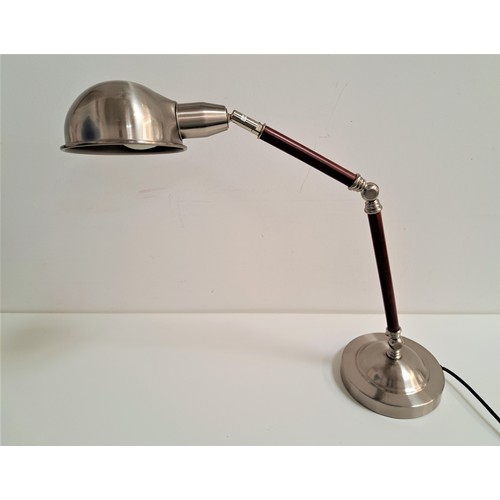 196 - MODERN ANGLE POISE LAMP
raised on a circular weighted base with a two section arm with a domed shade