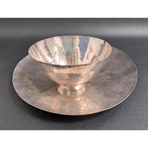 121 - 1970s SILVER DISH
of circular hammered form, 16cm diameter; together with a similar silver hammered ... 