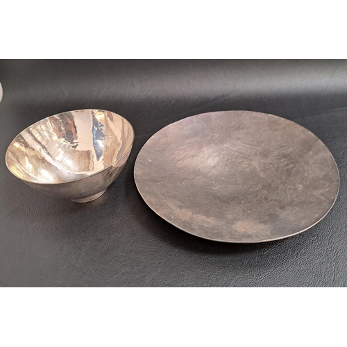 121 - 1970s SILVER DISH
of circular hammered form, 16cm diameter; together with a similar silver hammered ... 