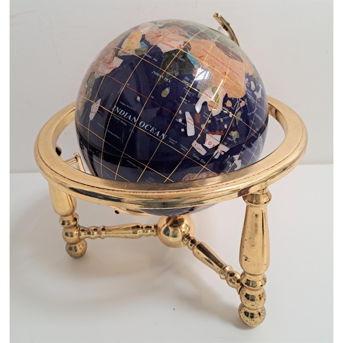 186 - SPECIMEN STONE TERRESTRIAL GLOBE
on a brass stand, 32cm high