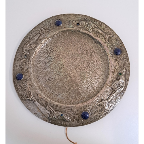 191 - ARTS AND CRAFTS PEWTER CHARGER
in the style of Liberty, with hammered decoration, the rim decorated ... 