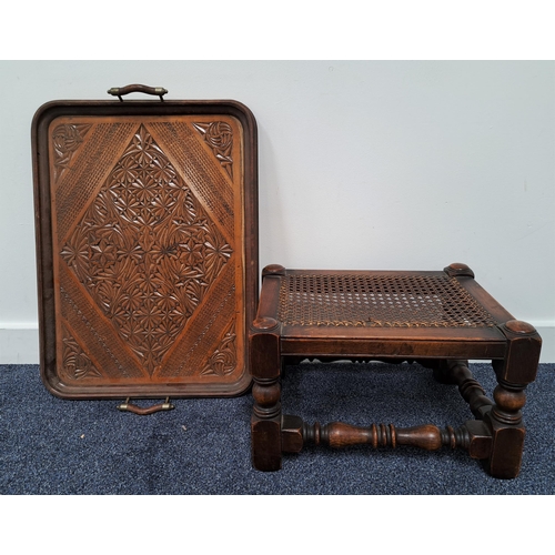 358 - OAK FOOT STOOL
with a cane seat on turned legs with turned stretchers, together with a teak carved t... 