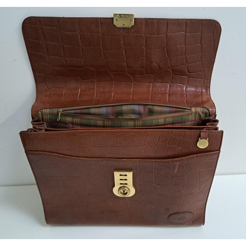 178 - MULBERRY SATCHEL/BRIEF CASE
with carry handle and brass lock, the tartan interior with a zip compart... 