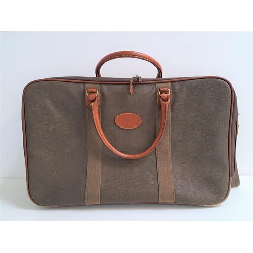 185 - MULBERRY SCOTCHGRAIN SUITCASE
with leather handles, wheeled base with canvas pull along handle, zip ... 