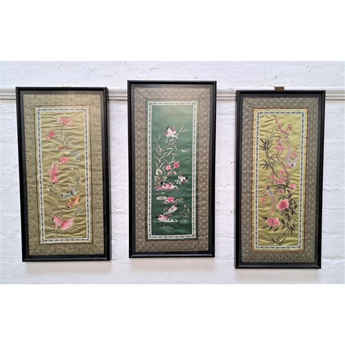 193 - THREE MID 20th CENTURY CHINESE SILK PANELS
all embroidered with two depicting birds and one fish, 62... 