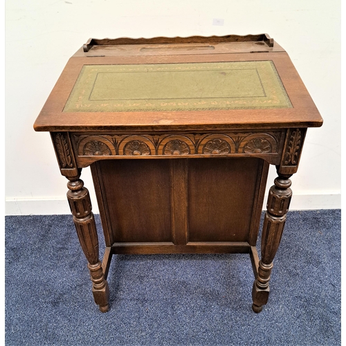 339 - 20th CENTURY OAK DAVENPORT
with a shaped gallery and pen tray and inset leather top opening to revea... 