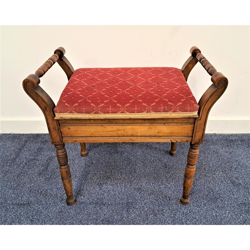 342 - EDWARDIAN MAHOGANY PIANO STOOL
with a lift up padded seat flanked by turned handles, standing on tur... 