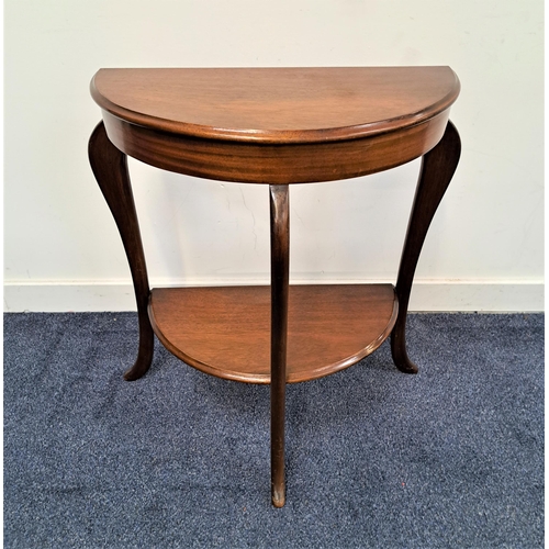 344 - MAHOGANY DEMI LUNE SIDE TABLE
with a moulded top on shaped supports with a shelf below, 70cm high