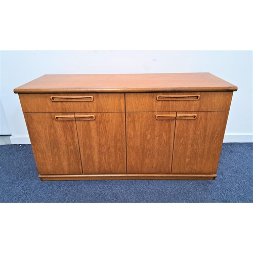 345 - MEREDEW TEAK SIDE CABINET
with two frieze drawers above two pairs of cupboard doors, standing on a p... 