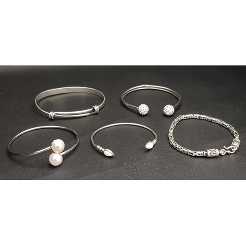 48 - SELECTION OF FIVE SILVER BRACELETS
comprising two stone set open cuff bangles, a pearl set open cuff... 