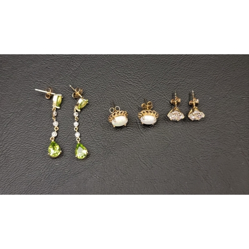 101 - THREE PAIRS OF GEM AND STONE SET EARRINGS
comprising a pair of peridot and diamond drop earrings in ... 