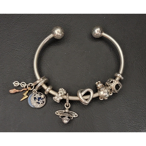 107 - PANDORA MOMENTS OPEN BANGLE
with seven charms including Sparkling Queen Bee Pendant, Harry Potter da... 