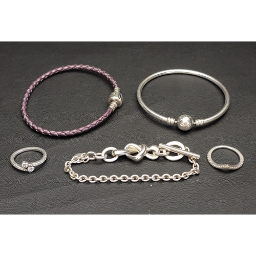 108 - SELECTION OF PANDORA JEWELLERY
comprising a Moments Bangle, a Moments Purple Leather bracelet, a Kno... 