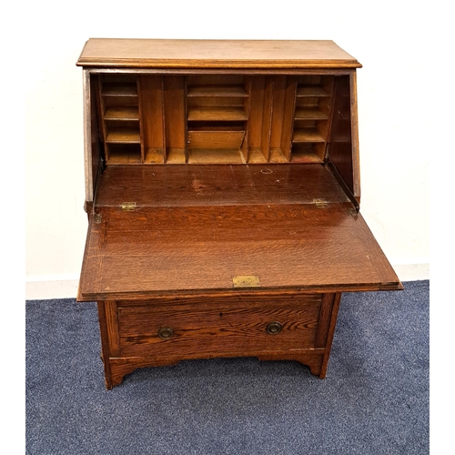 385 - OAK BUREAU
with a fall flap opening to reveal a fitted interior above three graduated drawers, stand... 