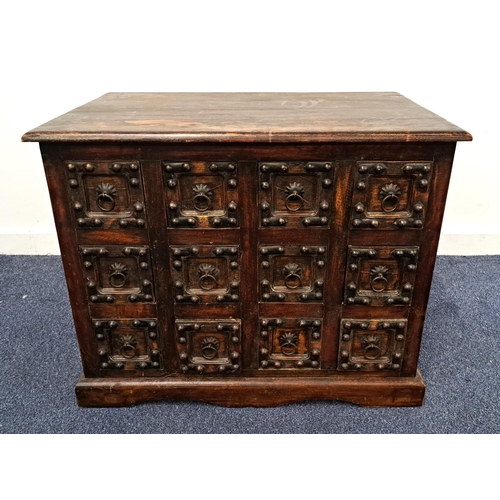 407 - MANGO WOOD CHEST OF DRAWERS
with a moulded top above twelve short drawers with stud decoration and r... 