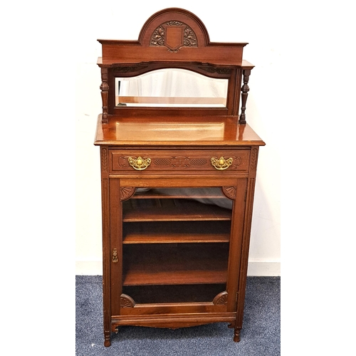 415 - EDWARDIAN MAHOGANY MUSIC CABINET
the shaped carved and raised back with a bevelled mirror above a ca... 