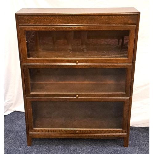 416 - GUNN OAK SECTIONAL BOOKCASE
with three glass up and over doors, 112.5cm x 87cm